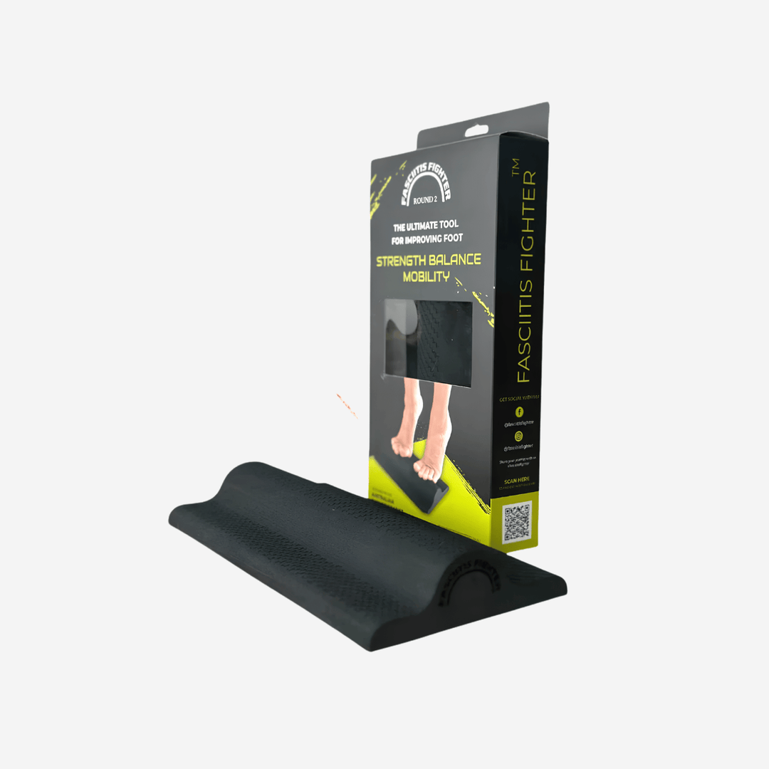 A black textured balance board shown in front of its retail packaging box on a light gray background. The packaging is black with yellow and white text, featuring the brand name 'FASCITIS FIGHTER'.