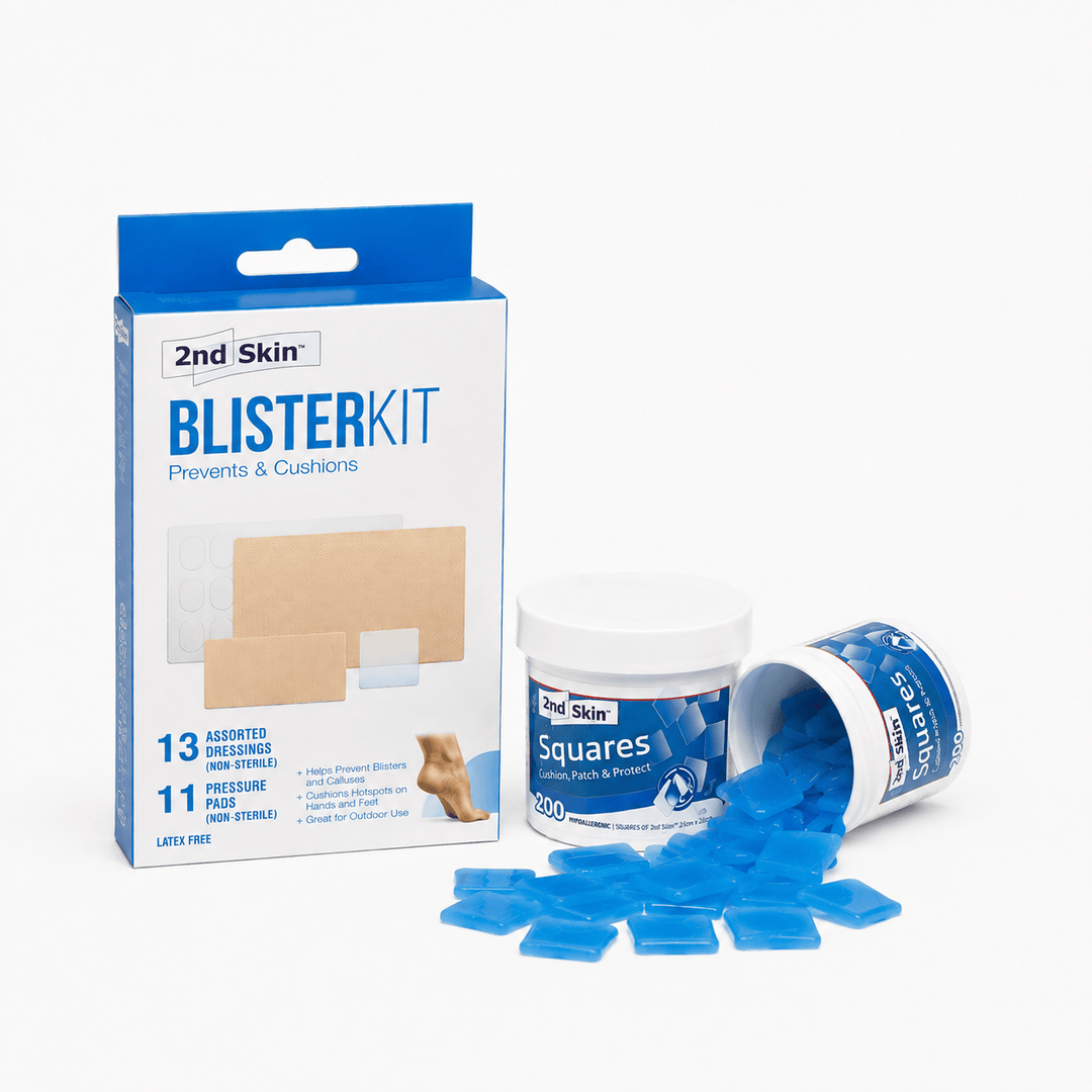 2nd Skin Blister Kit shown with its retail box, a white jar spenco second skin squares patches, spilled blue square blister pads, and a clean white background.