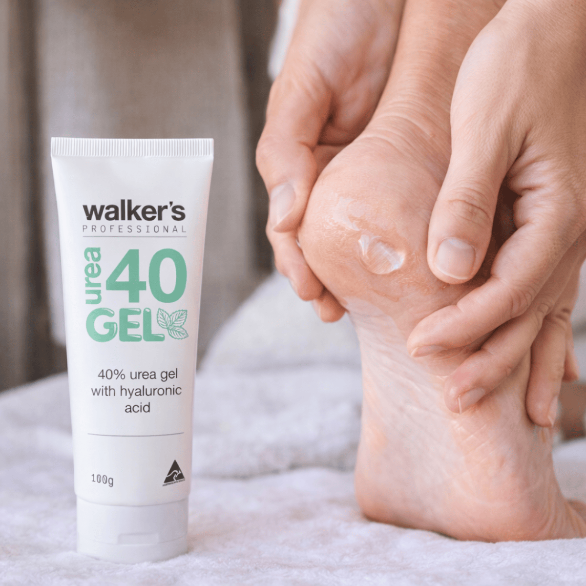 Walkers Foot Cream Walkers Urea 40 Foot Gel With Hyaluronic Acid applying cream to feet